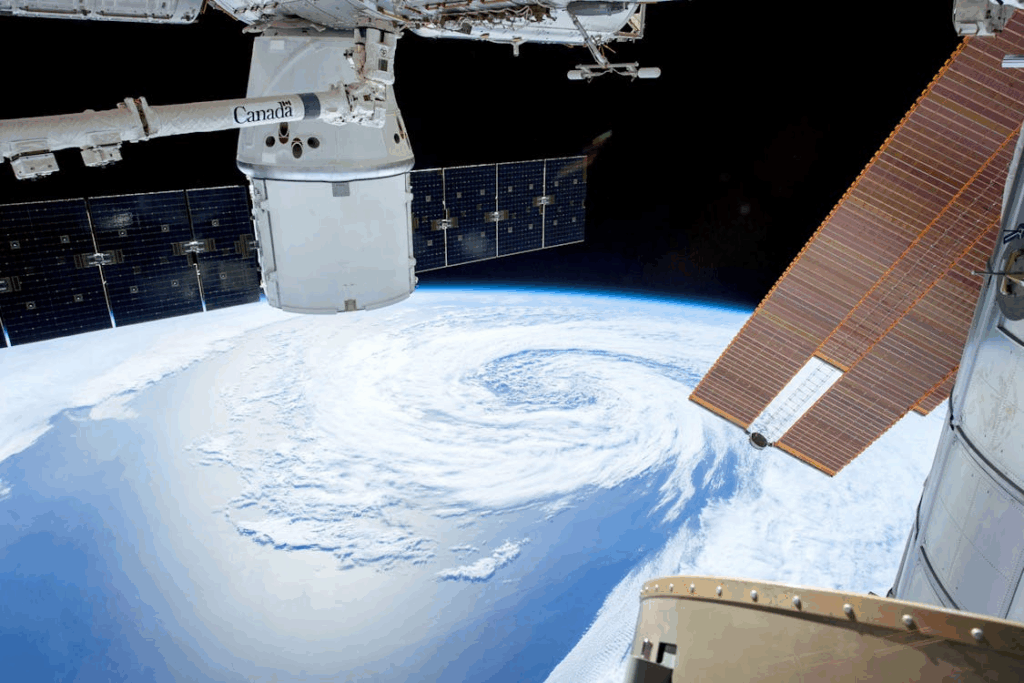 Earth observation satellite capturing a swirling storm from space, supporting real-time disaster response.