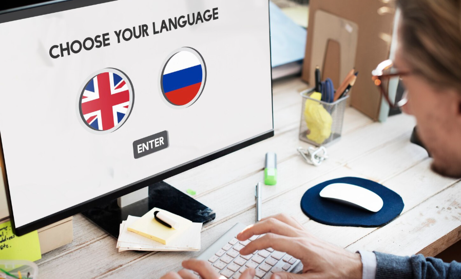 Person using computer language selection screen, illustrating internet languages options.